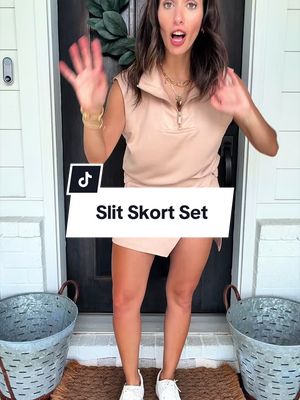 Upgrade your warm-weather wardrobe with this women’s sleeveless two-piece skort set featuring a stylish quarter-zip collared top and matching mini skort. Designed with a flattering relaxed fit and buttery-soft fabric, this coordinated outfit combines comfort and effortless style. Perfect for vacations, brunch dates, travel days, shopping trips, casual weekends, resort wear, and everyday chic looks. The versatile matching set creates a polished outfit with minimal effort while keeping you comfortable all day long. * sleeveless quarter zip skort set for women * women’s matching skirt outfit summer * resort wear two piece set women * casual vacation outfit women * buttery soft skort set women * travel outfit with matching skirt * country club inspired outfit women * chic summer matching set * collared tank top and skort set * comfortable elevated casual wear    #