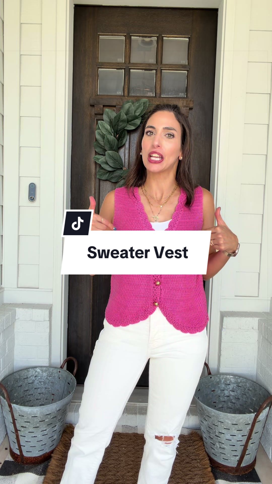 The sweetest little sweater vest with scalloped detail and gold buttons!